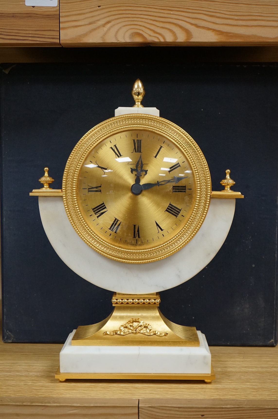 A 1970's Hour Lavigne white marble and gilt bronze mantle timepiece, boxed, 29cm high